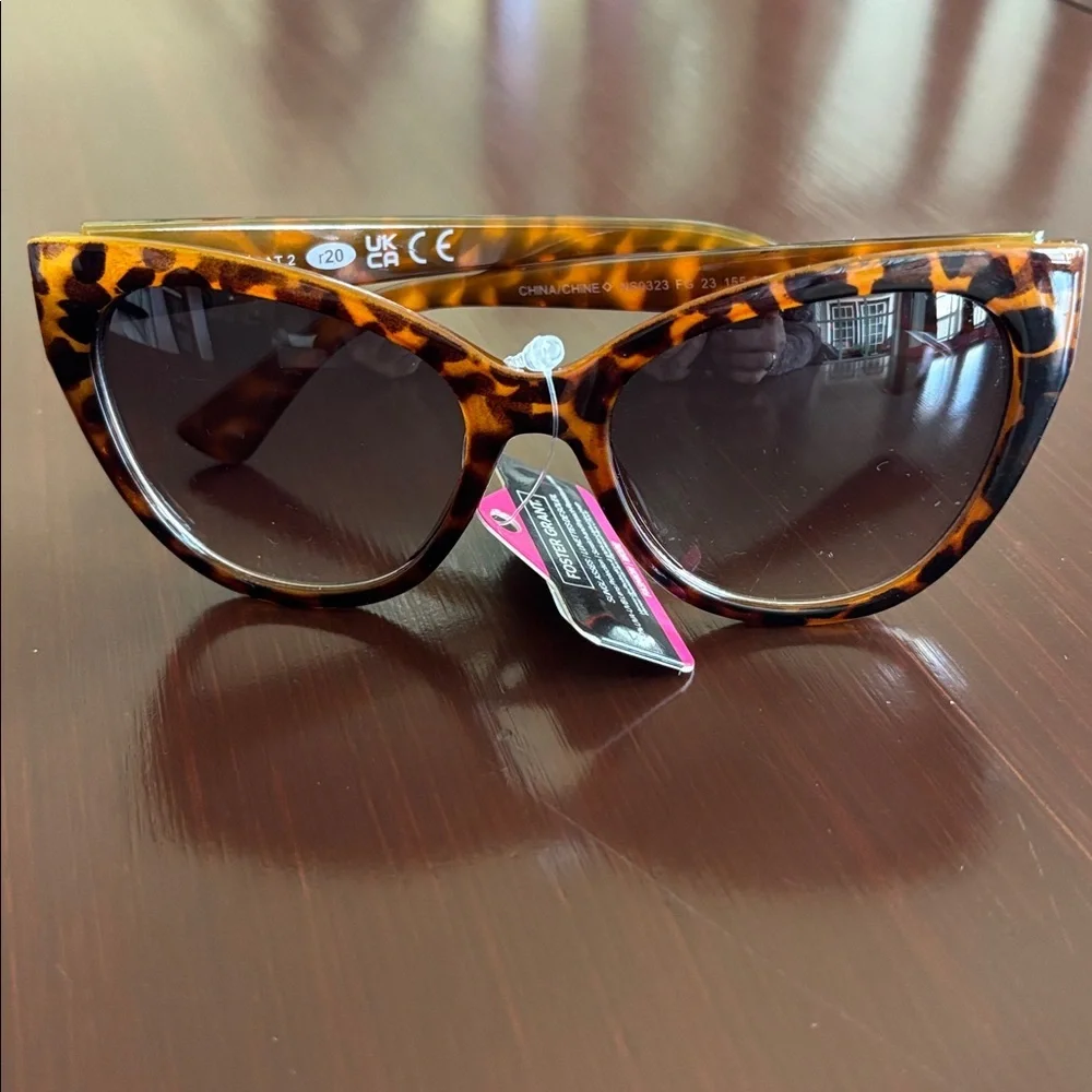 Foster Grant 100% UVA-UVB protection leopard print, gold tone beaded frame edge